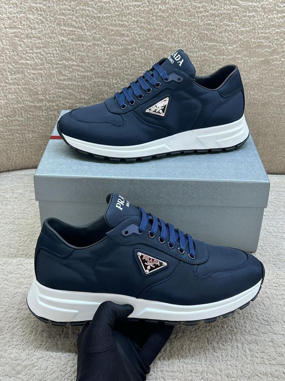 Prada Prax 01 Re-Nylon and Leather Sneakers in Navy Blue.